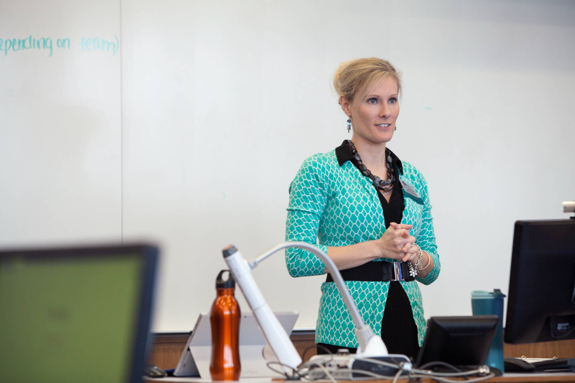 Meagan Knoll teaching in the front of a classroom